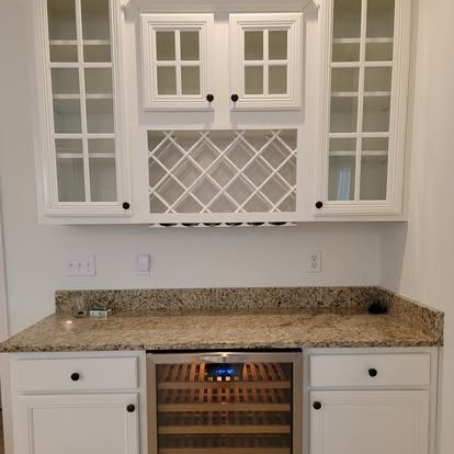 After: bar cabinets painted white with fresh light walls
