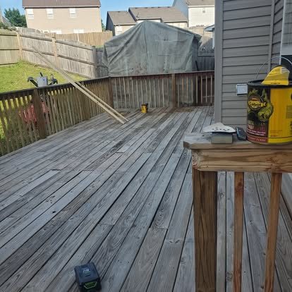 Before: gray, weathered wood deck