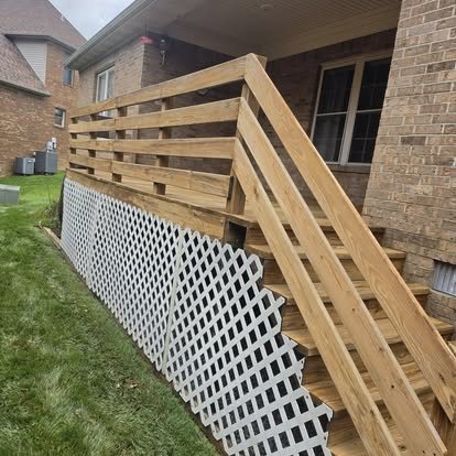 New wooden deck stairs and railing with white lattice skirting