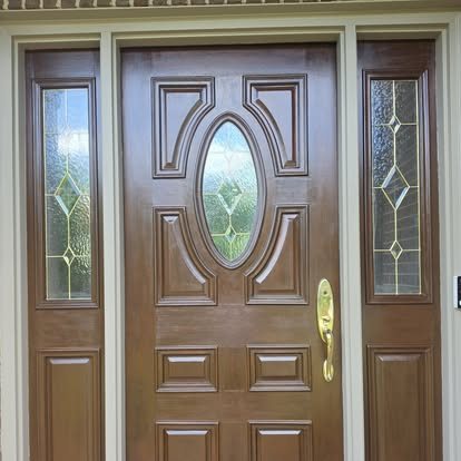 After: front door and sidelights refinished in a rich glossy brown