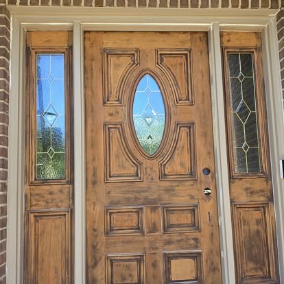 Before: weathered, sun-faded wooden front door and sidelights