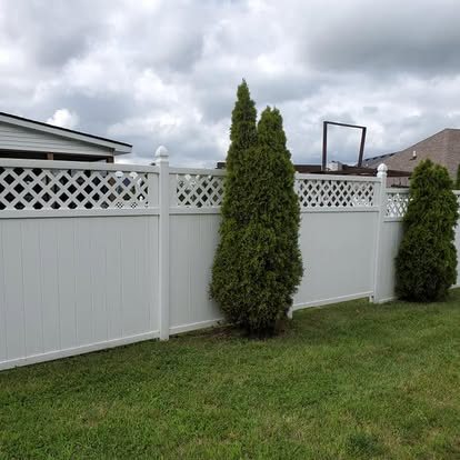 After: clean white vinyl privacy fence
